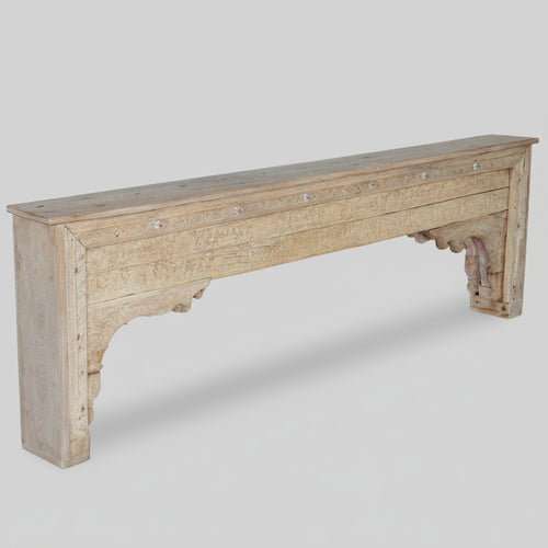 Long wooden console with a rustic finish on a white backgrund