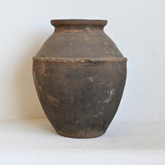 Vintage terracotta pot on a white background