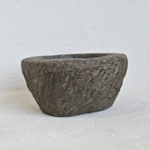 Rustic stone bowl on a light background