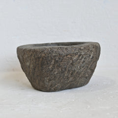 Rustic stone bowl on a light background