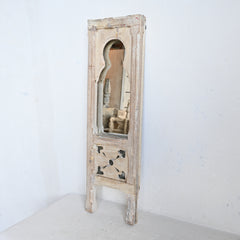 Vintage-style leaning mirror with wooden frame on a white background