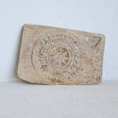 Wooden  wall hanging board with hand carved star design on a white background