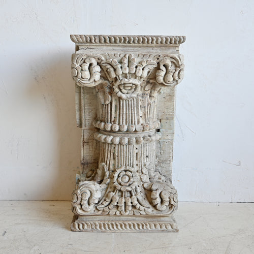 Decorative stone column on a white background