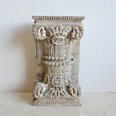 Decorative stone column on a white background