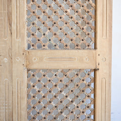 Wooden door with geometric lattice design